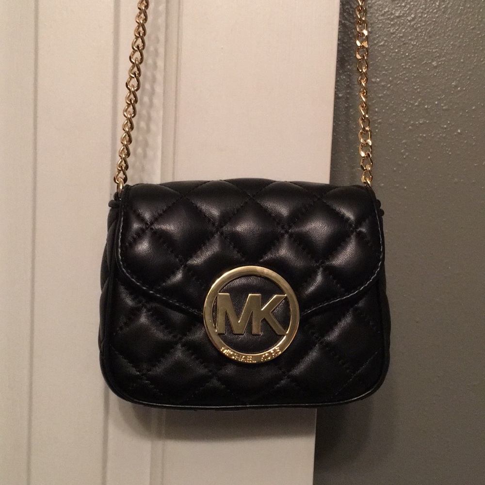 Michael Kors purse. Never used. Even smells new.